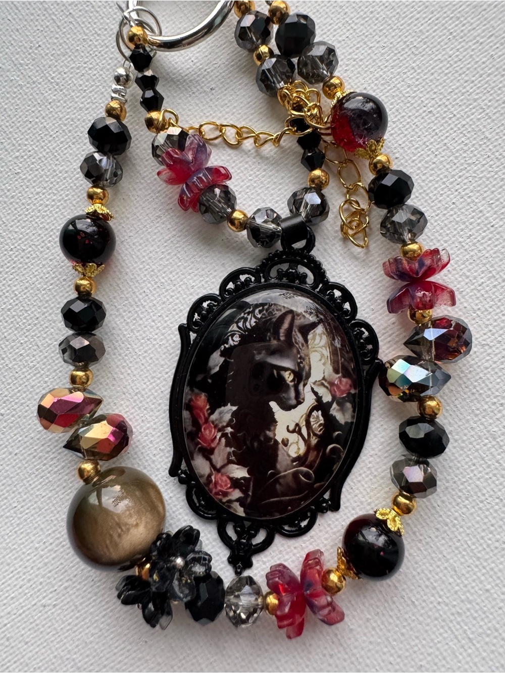 Vintage-Inspired Black Cat Cameo Phone Charm with Pink Flower Accents